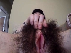 Amateur brunette milf exposes her hairy bush on webcam