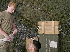 Army stud gives bareback blowjob to tattooed blonde boyfriend on duty