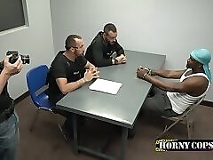 Interracial gay threesome in interrogation room in the office of cops