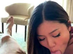 Stunning Asian girl puts her lovely lips to work on a cock