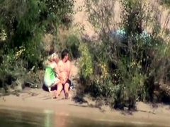 Exciting blonde having fun with her boyfriend by the river