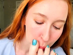 Foot fetish redhead teen licking her lovely toes on webcam