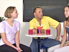 The horny nerd plays with 2 girls